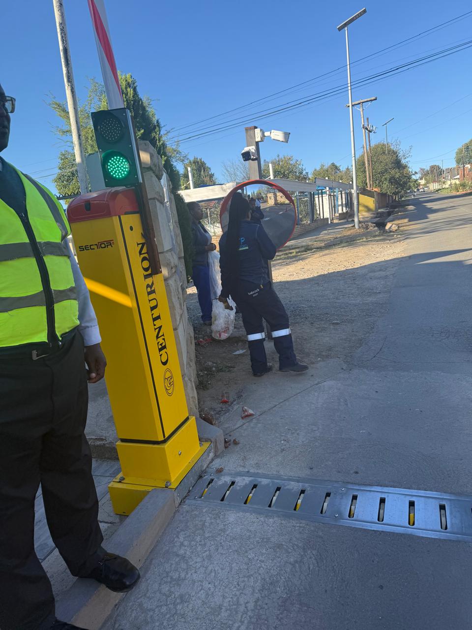 Integrated boom gate, traffic light and surveillance equipment