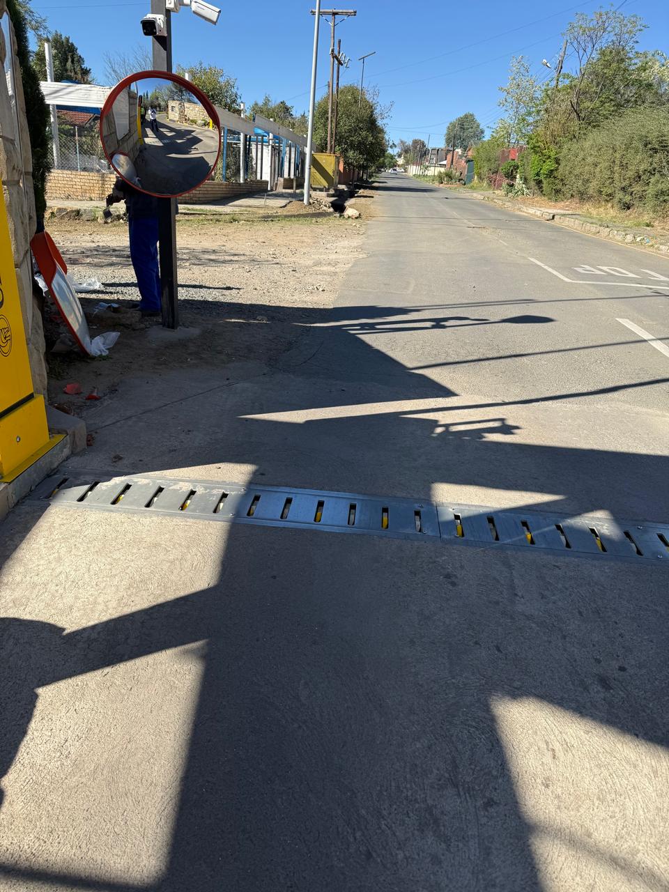 Convex mirror positioned to improve road visibility